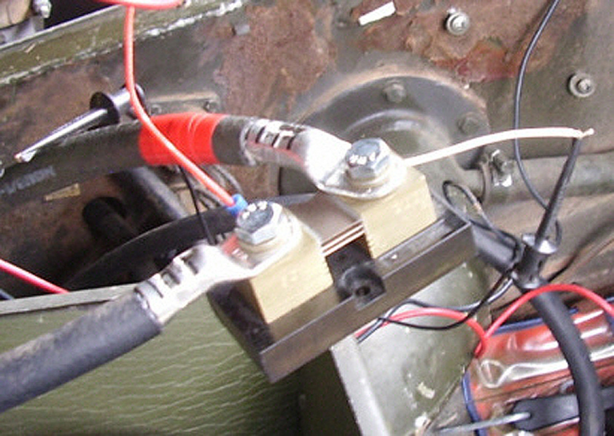 A shunt resistor is used to measure high currents. Instead of measuring the current directly, the voltage drop across the shunt is measured and is easily displayed on most digital voltmeters. The shunt is installed so that the (start motor) current flows through it.