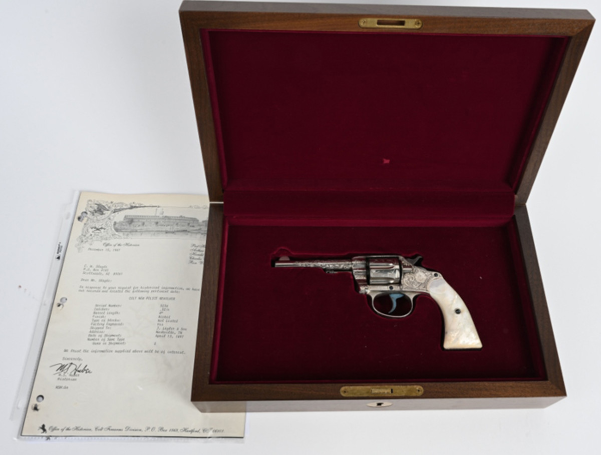 Antique 1897 Colt .32-caliber ‘New Police’ revolver with American-scroll engraving by Cuno Helfricht. Solid 99% gun with near-mint bore and action. Comes in modern Colt walnut fitted case.