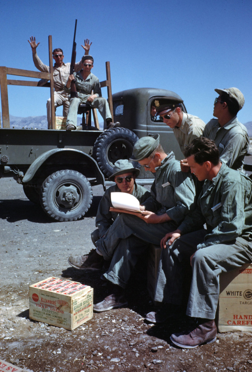 LAS VEGAS, NEVADA - CIRCA 1942: Soldiers train at the flexible gunnery training with shotguns and trap loads at the Las Vegas Army Airfield in Las Vegas, The pickup in the back is a 1/2-ton Dodge (possibly a WC-1) Nevada. Circa 1942.