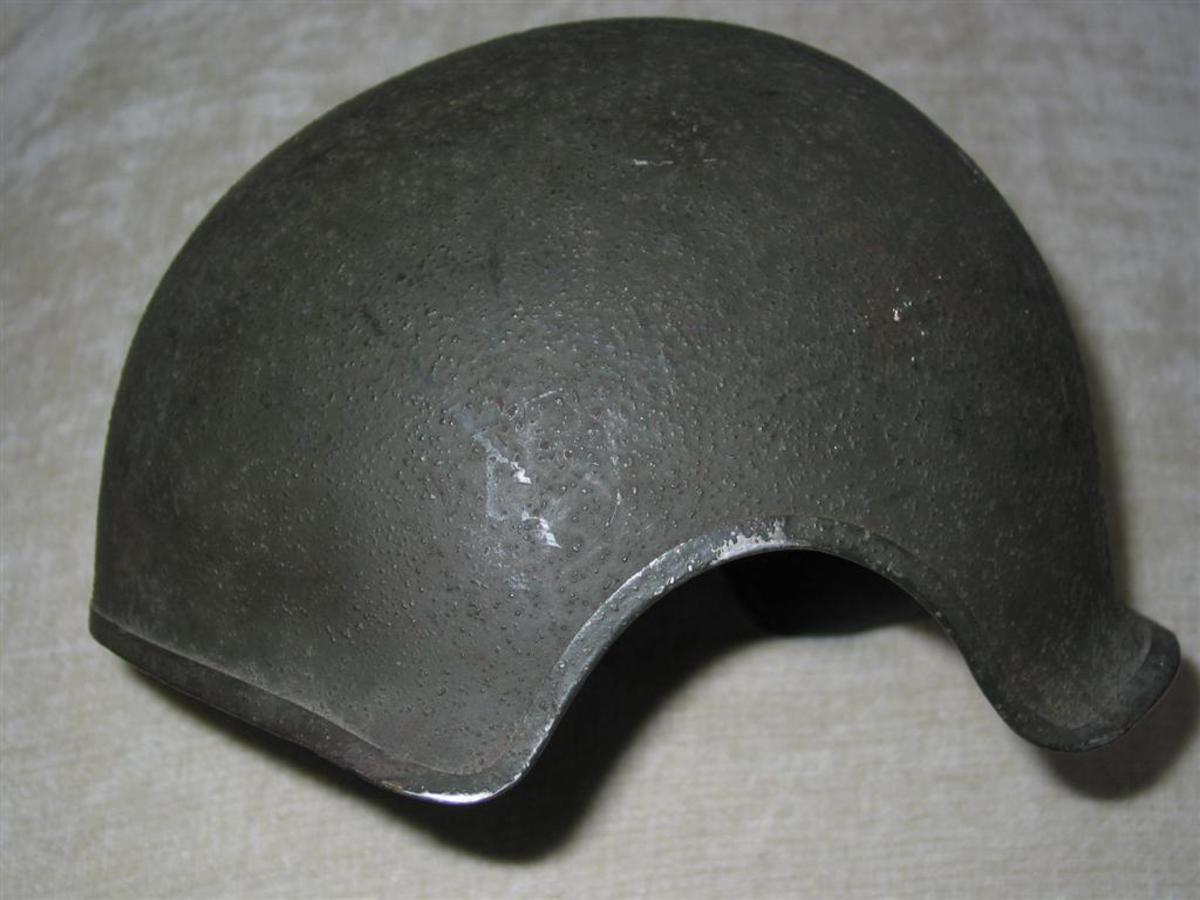 The first crash helmet liner was designed to accompany the T-19E1 helmet shell. Two hundred of this liner and shell were tested by the Armored Board in early 1945 but rejected because of instability. The original test liner did not have a chin strap and the interior lining was constructed differently than the final version.  The Armored Medical Board though rejecting the T-19E1 shell did accept the liner portion with the addition of a chinstrap. The modified liner was to be called the ‘Liner, Helmet, M-1, Crash’ and was to be used with the steel shell portion of the M-1 infantry helmet until a replacement for the T-19E1 could be developed. The Armored Board ordered the new liner into immediate production.