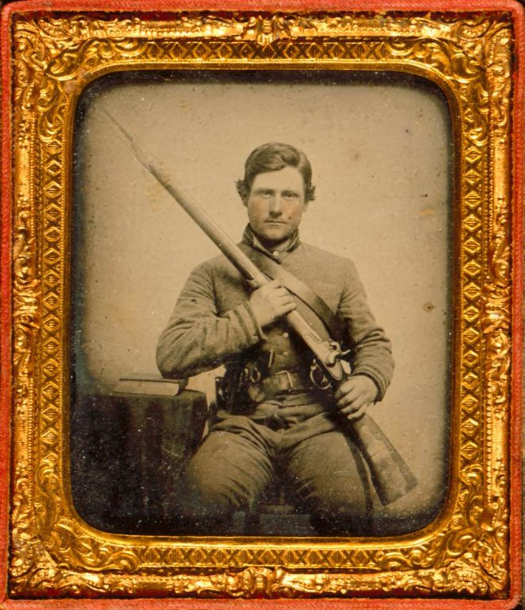 Cased ambrotype portrait of C.S.A. Corporal Anthony Sydnor Barksdale (1841-1923), taken 1861 with Mississippi rifle.