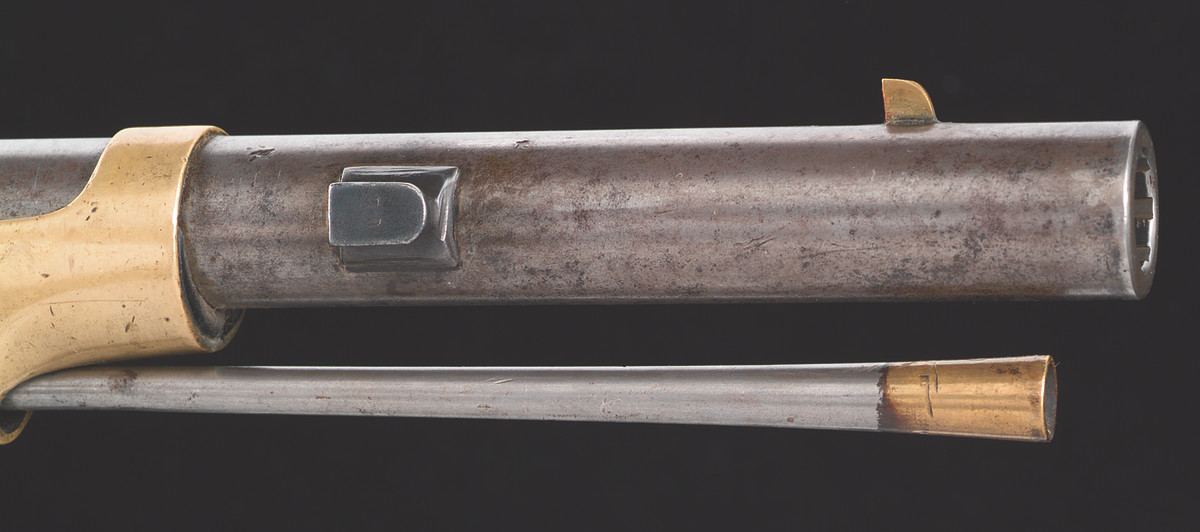 Remington brazed a slightly longer than ½” stud 4-1/2” from the muzzle on the right side of the barrel to accept a Collins brass-hilted saber bayonet