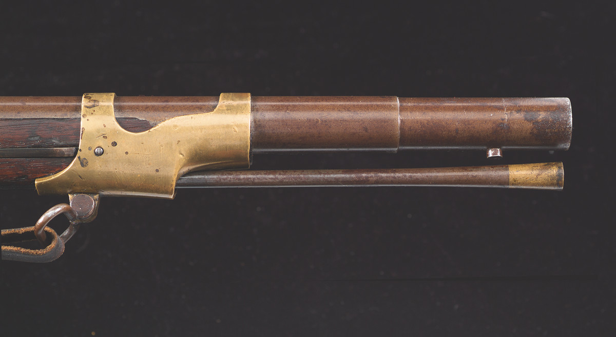 The front 2-3/4” of the barrel was turned to 13/16” inches and a round stud fastened to the bottom of the barrel to accept and hold a bayonet in place. The front sight was mortised into the socket of the imported Belgian or Austrian bayonet rather than on the muzzle of the barrel.
