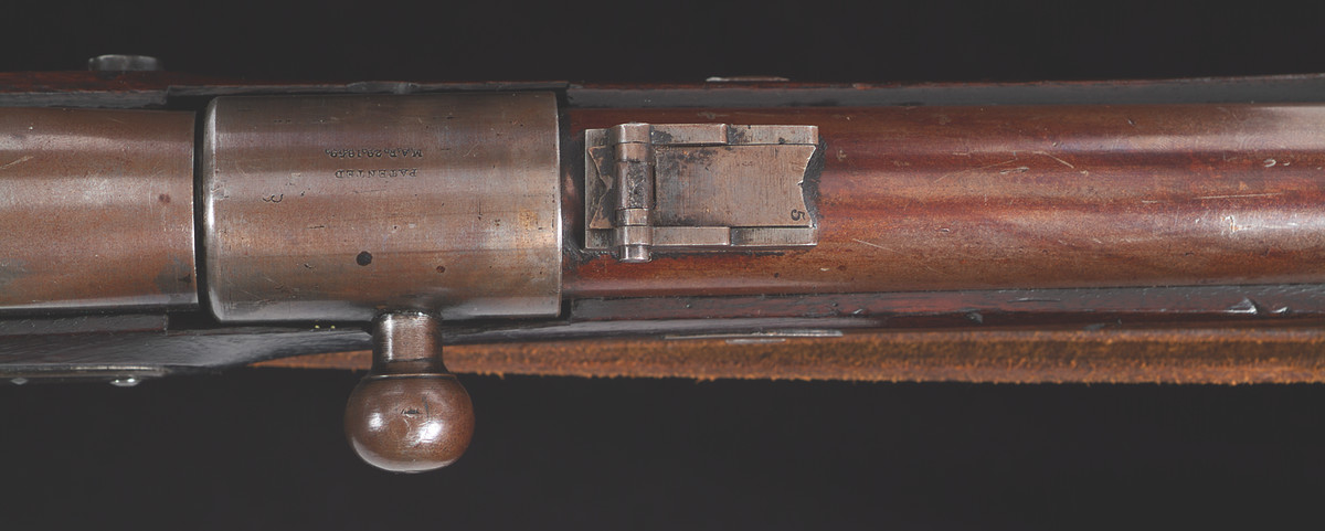 The barrel was cut off 4-1/2” from the breech and a new action installed. When the shooter flipped the bolt of a sleeve to the left, the spring-operated breech popped up, allowing the chamber to be loaded from the front with a .54-caliber combustible cartridge. After pressing the breech unit back down and flipping the sleeve back to the right, the rifle was ready for firing.