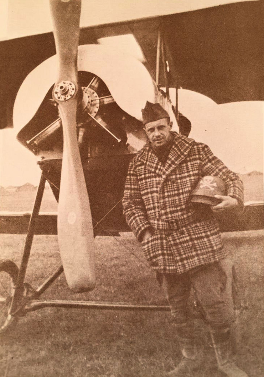 Wartime photo shows Parsons holding his helmet in front of his Escadrille plane.