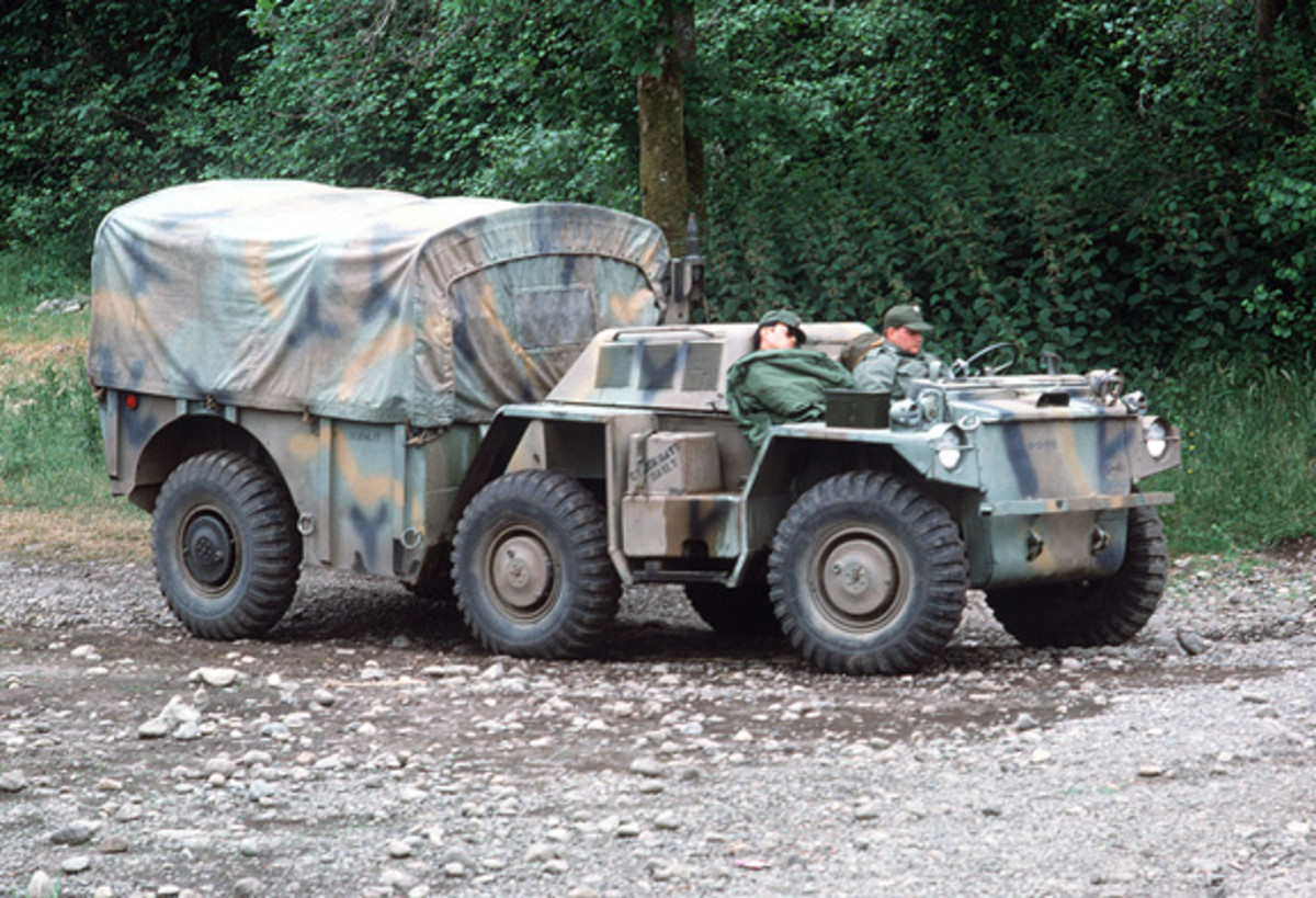 Soldiers take a break in an M561 1 1/4-ton truck.