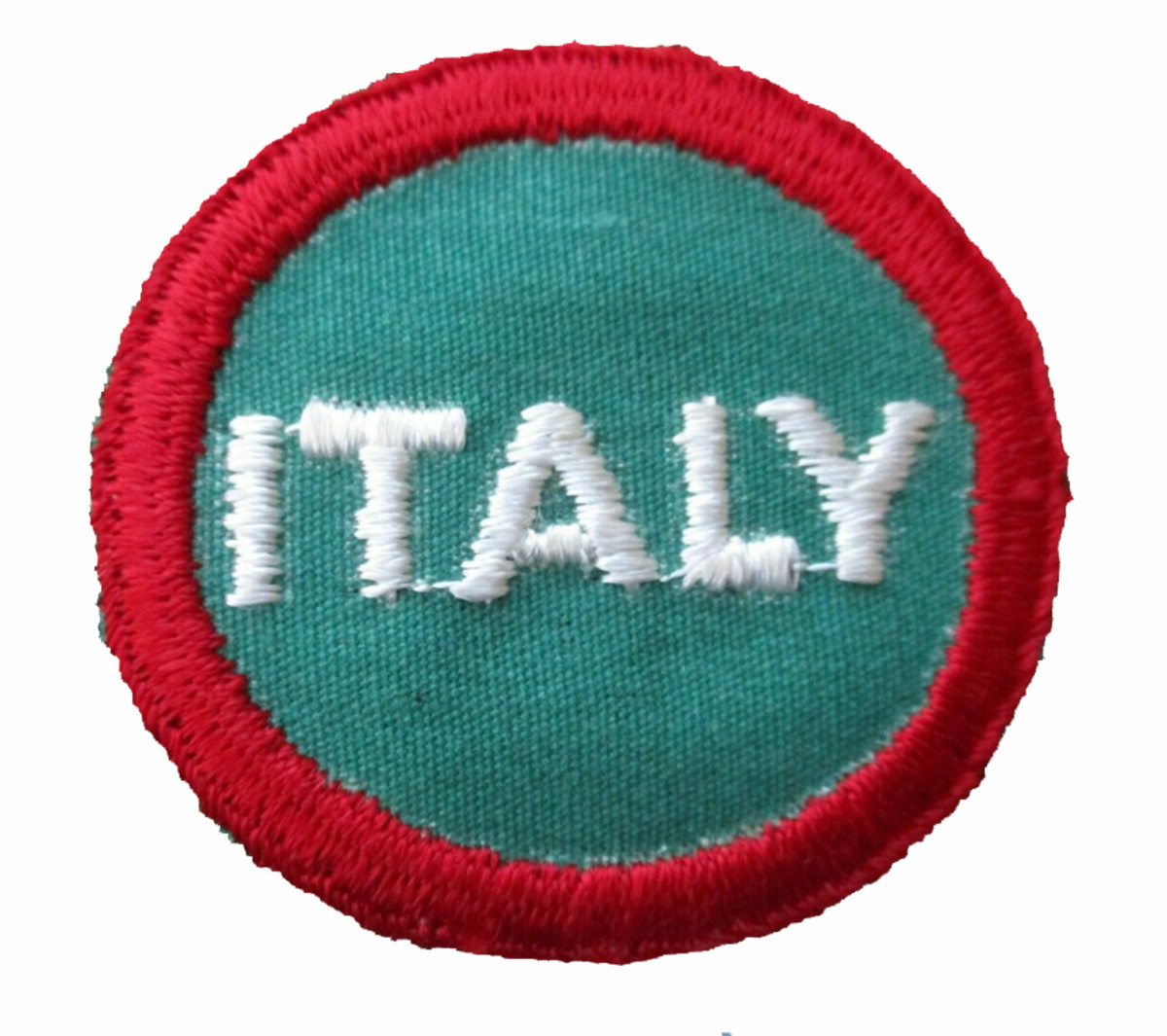 On the army overseas cap, the I.S.U. wore a circular patch two inches in diameter, bordered in bright red, with a dull green center in which ITALY appears in embroidered white letters, three-eighths inches high.