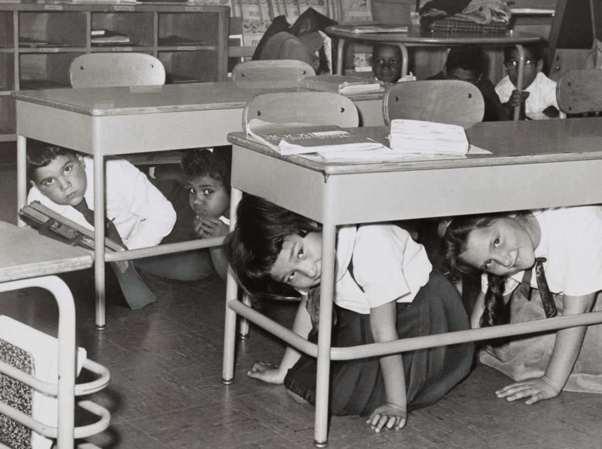 Students at a Brooklyn middle school have a ‘duck and cover’ practice drill in 1962 in preparation for a nuclear attack.