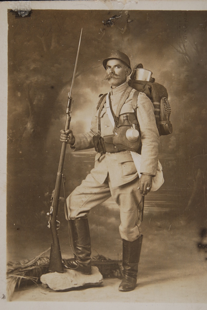 Real photo postcard of fully equipped French soldier sporting a large mustache.