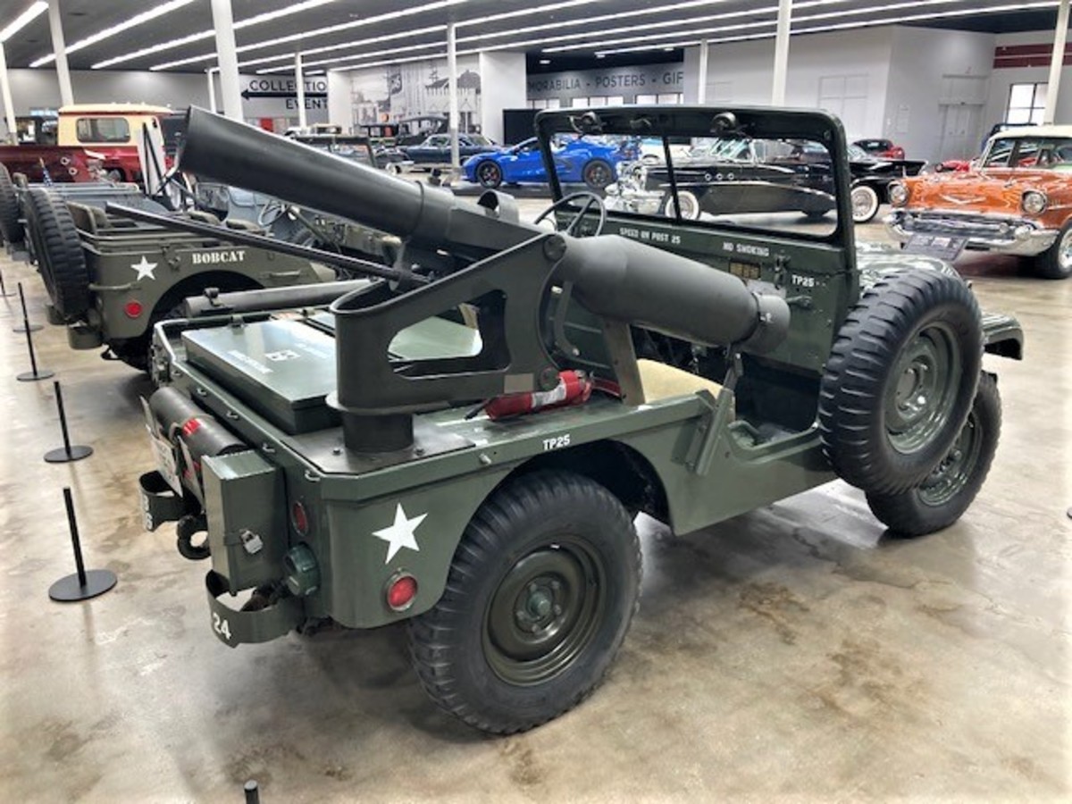 Military vehicles on display include a 1952 M38A1D Willys jeep with Davy Crocket launcher owned by CSM (Ret) Lowell May and Janice May of Manhattan, Kansas.