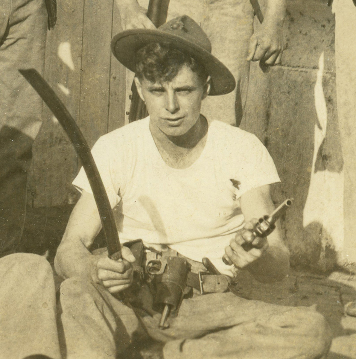 Unidentified member of the 29th Company showing off some captured arms is clearly wearing the P1912 hat as revealed by the rolled over brim.