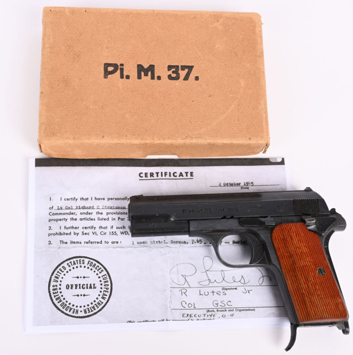Captured Hungarian M37 Femaru Third Reich pistol in original box, manufactured in 1943 under German occupation and redesigned with a manual safety. This model was issued primarily to the Luftwaffe. Near-pristine condition and a recent discovery, never before offered at public sale, it sold for $7,500 against an estimate of $3,000-$5,000