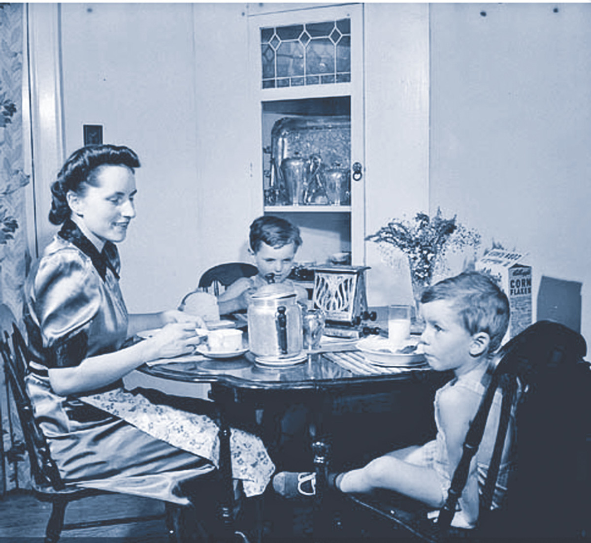 By the later war years posters, such as Mrs. Jack Wright and her two sons Ralph and David eating breakfast replaced the Bren Gun Girl campaign.