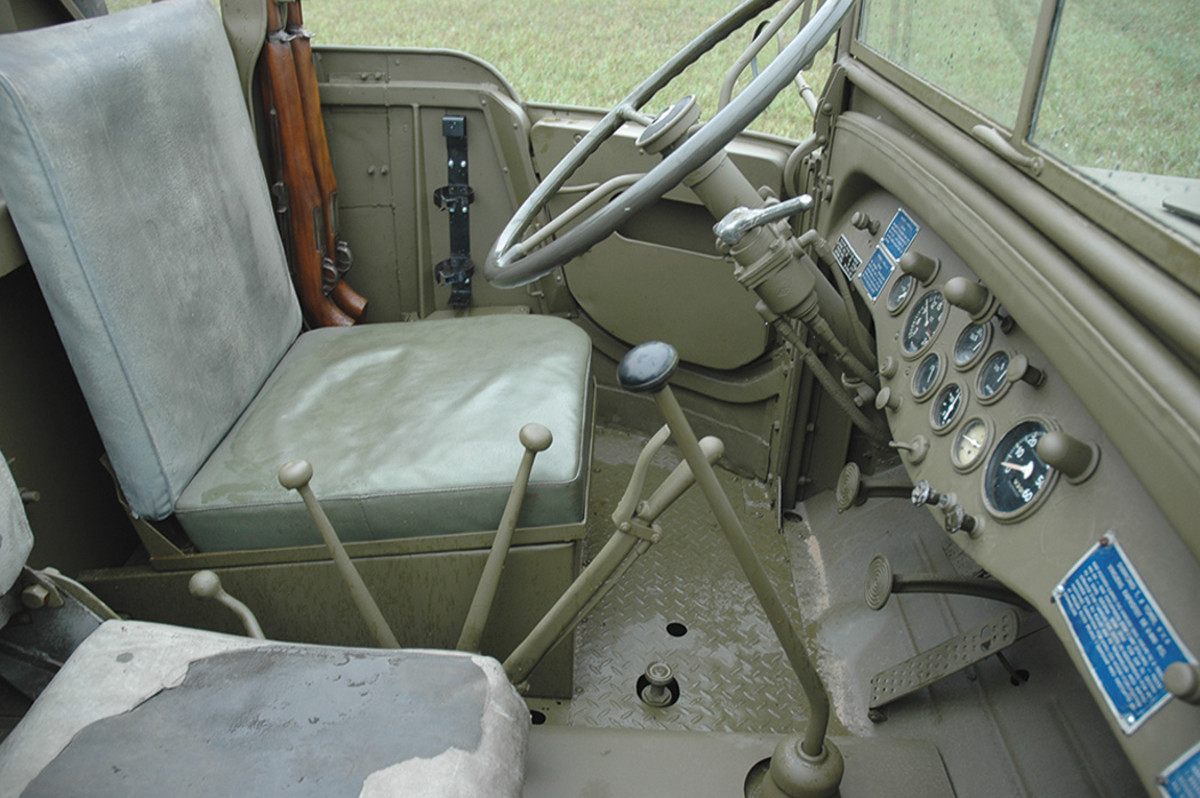 Typical of military standard open truck cab designs, the interior of the Diamond T can be described as “spartan.” Rising from the center is the shift lever for the Clark transmission, with the transfer case controls between the driver’s and passenger’s seats, along with the lever controlling the disc-type parking brake.