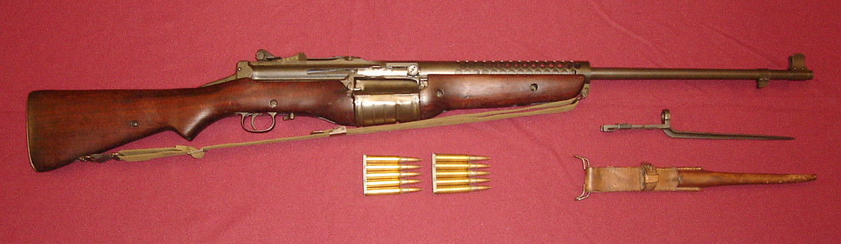 Johnson M1941 Semi-Automatic Rifle with original spike bayonet and leather sheath. The 10-round rotary magazine could be quickly reloaded using two clips of .30 Caliber M2 Ball ammunition.