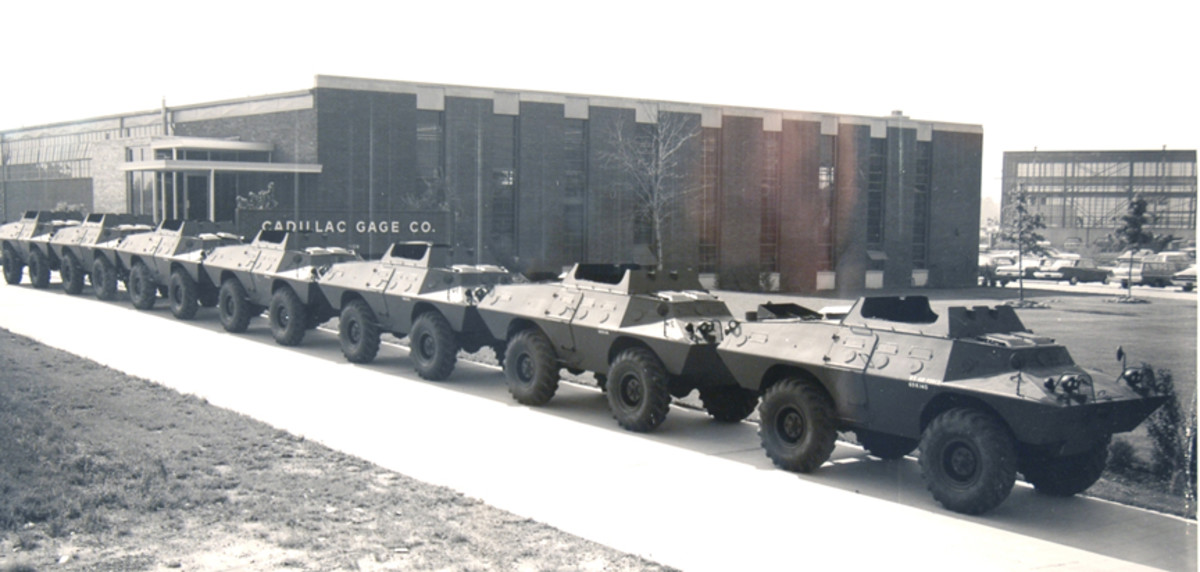 Seven early XM706E2 Commandos (notice the four vision ports in the side) await delivery outside Cadillac Gage’s Detroit plant in 1969.