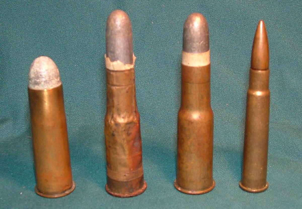 (From left to right): A .577 Snider cartridge, a Zulu War–era rolled brass foil .577/450 Martini–Henry Cartridge, a later drawn brass .577/450 Martini–Henry cartridge, and a .303 British Mk VII SAA Ball cartridge