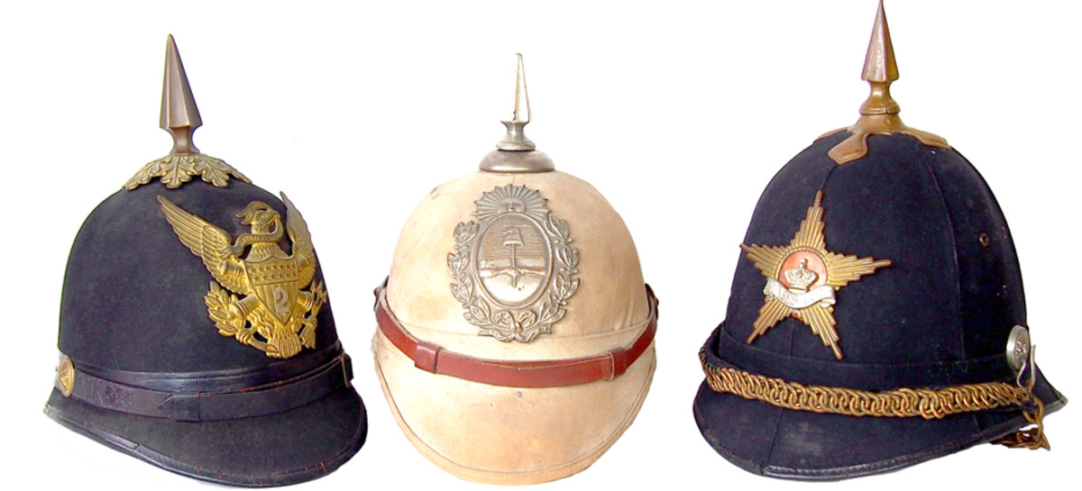 A side-by-side comparison of a Prussian Model 1891 officer’s helmet and a British 1878 Pattern Home Service Helmet to Gloucestershire Regiment. The helmets have only a passing resemblance but the materials differ greatly, as does the overall shape.