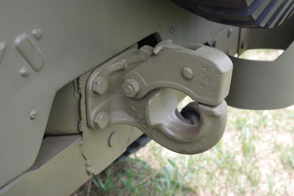 The pintle hook used is the Holland Hitch Co. Model T-60-A without trailer safety chain eye bolts which weren't added till truck 158,372.