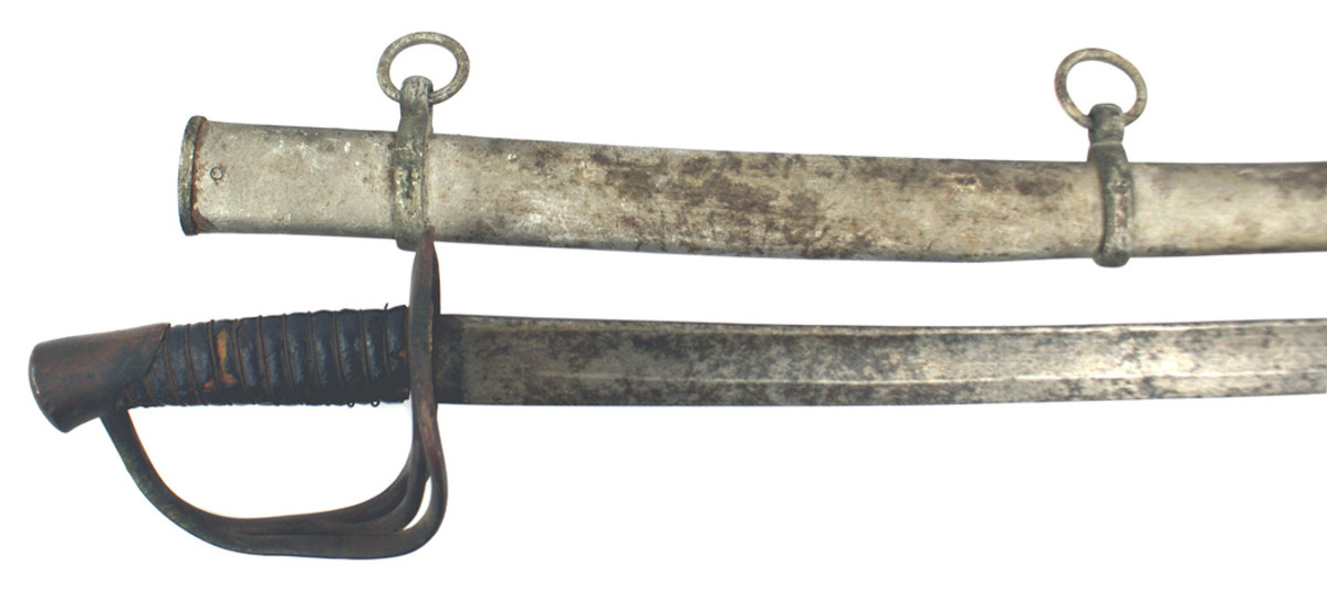 Perfect example of a classic Confederate “dog-river” Cavalry sword, having a straight type brown leather grip wrapped with iron wire and a 34-inch curved blade.