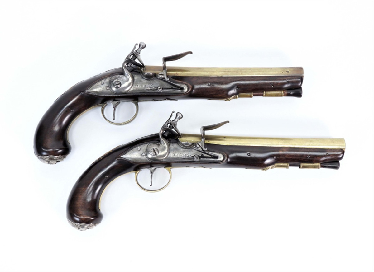 A Pair of English silver and brass mounted flintlock pistols from around 1760, both 13 inches in length including the barrel, to be sold together as one lot.