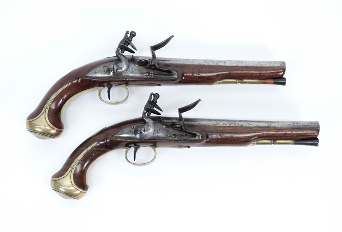 Jover flintlock pistols: Pair of British Jover flintlock pistols from around the 1770s, .62 bore, each with an 8 ¼-inch-long barrel and an overall length of 14 ½ inches, being offered as one lot.