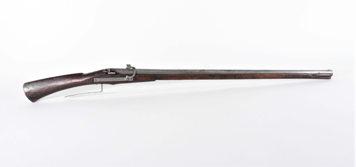 Match lock musket: 16th century German lever-trigger military match lock musket, .71 bore, having a walnut stock with a three-dot stamp on the right side behind the lock plate.