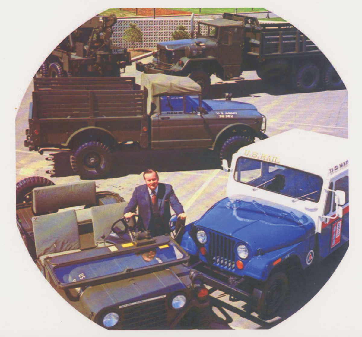 In this publicity shot, AM General president Cruse W. Moss is surrounded by a variety of the company’s products, including (clockwise from lower left), an M151A2, M715A1, M816, M821 and DJ-5A. This image appeared in the 1971 American Motors stockholders annual report.