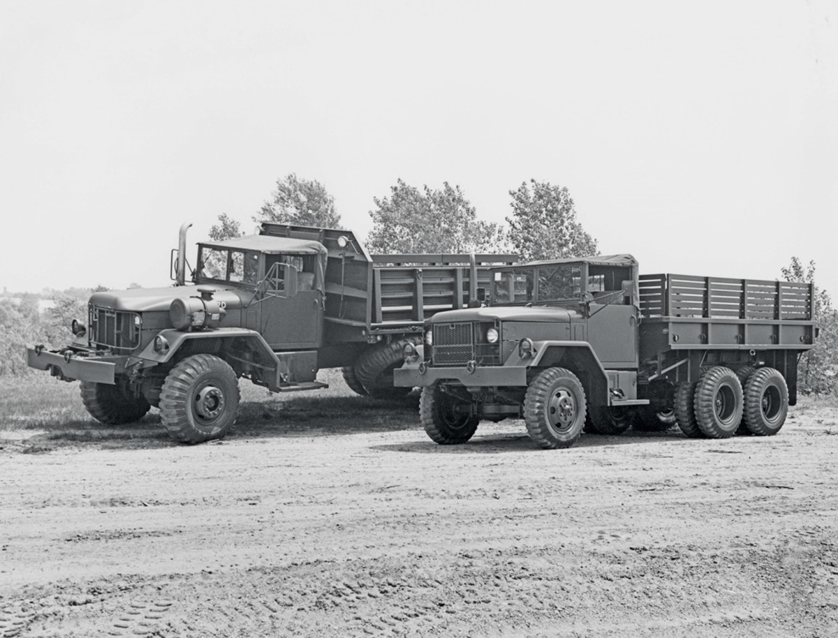 When American Motors bought the General Products Division from Kaiser Jeep the Main Plant was busy with the production of Multifuel engine-powered 2 ½-ton 6x6 trucks and Cummins NHC-250-powered 5-ton 6x6 trucks. An example of each of these types are shown here with a M35A2 cargo truck, beside which is parked a M821 bridge truck. The M821 was the largest and one of the heaviest of this series of five-ton trucks.