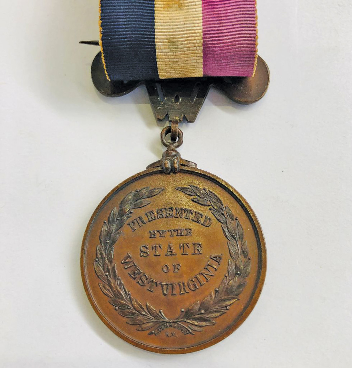 All three versions of the West Virginia Civil War medal had identical reverses and the maker hallmark A. Demarest, N.Y. below the tie in the wreath. W.V. medal images from the Robert Wilson collection