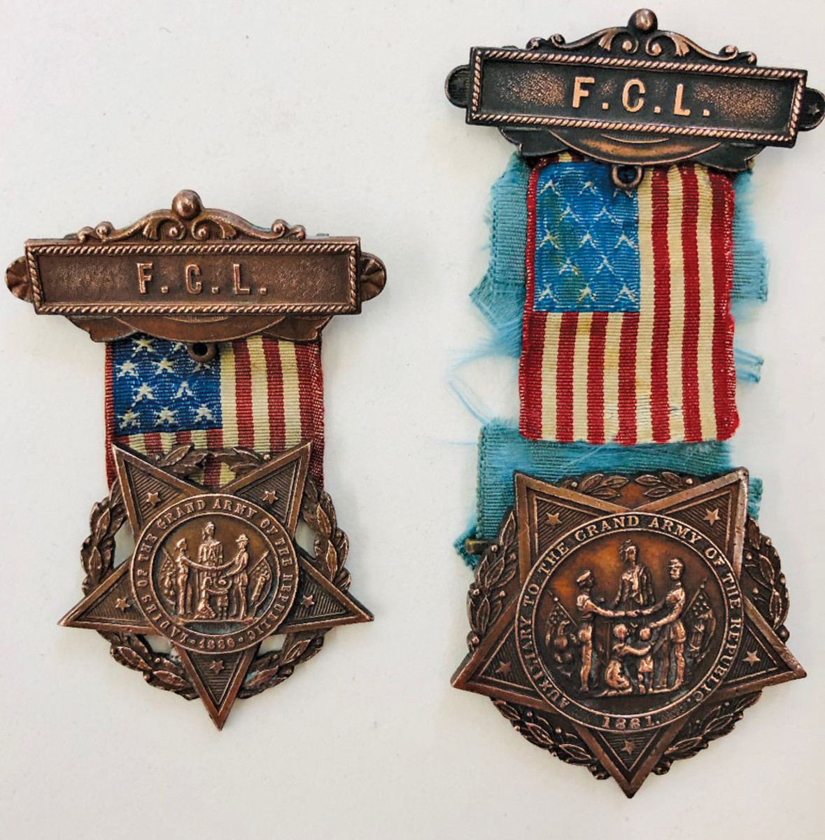 Two variations of the Ladies of the Grand Army of the Republic membership medal.