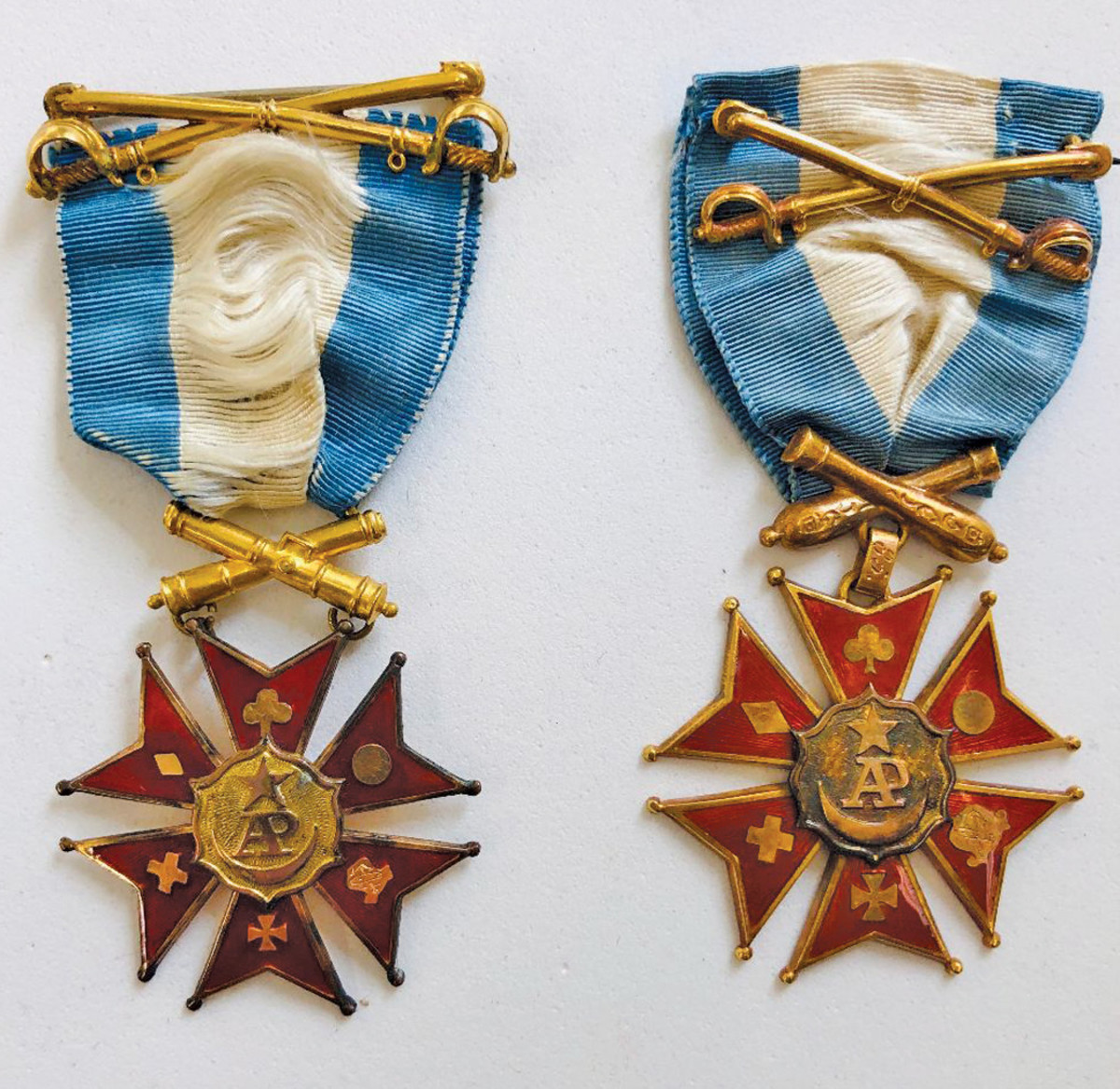 Two examples of the Society of the Army of the Potomac membership medal show slight variations in size as well as suspension.