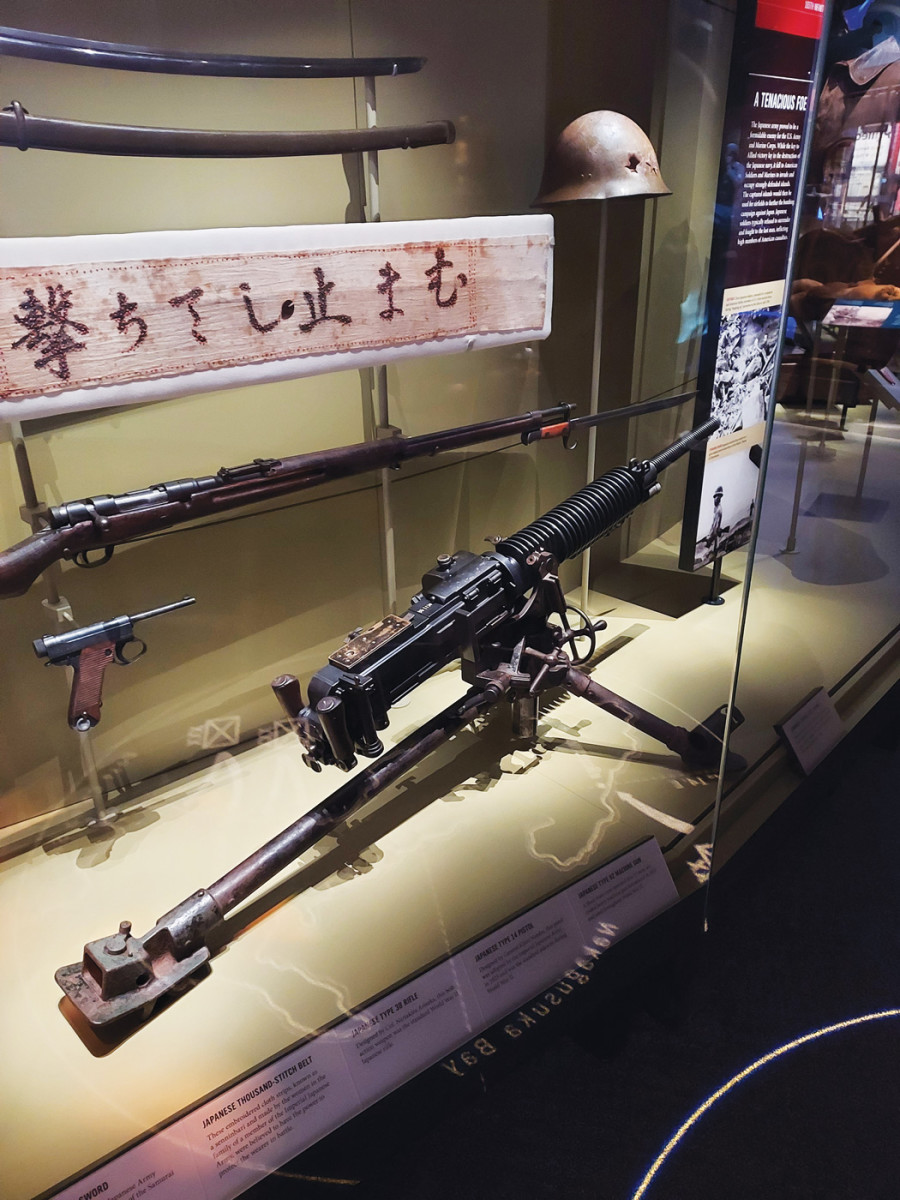 The collection features an assortment of small arms, including this rare Japanese Type 92 heavy machine gun.