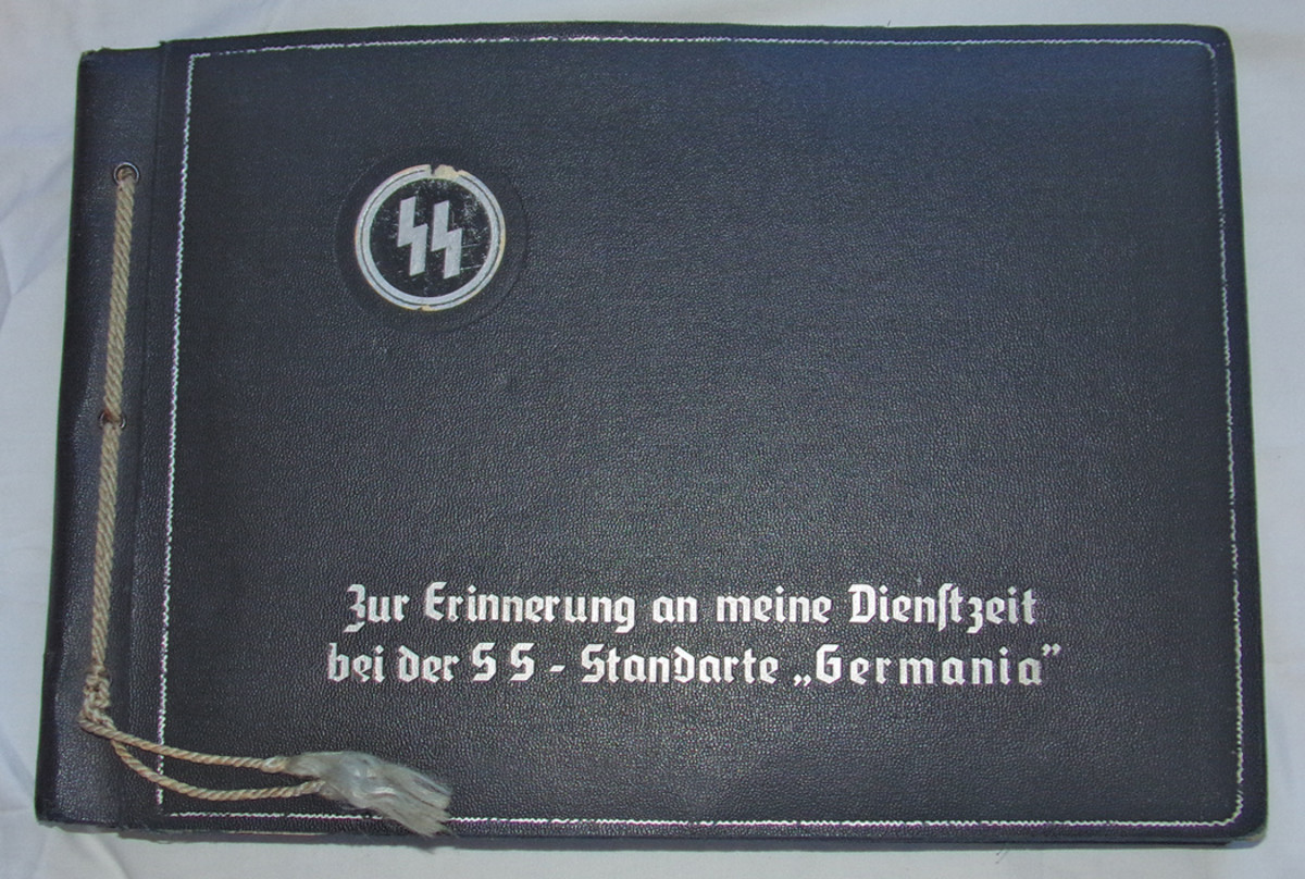 This interesting SS Standard “Germania” album has a mixture of photos and SS helmet decals.