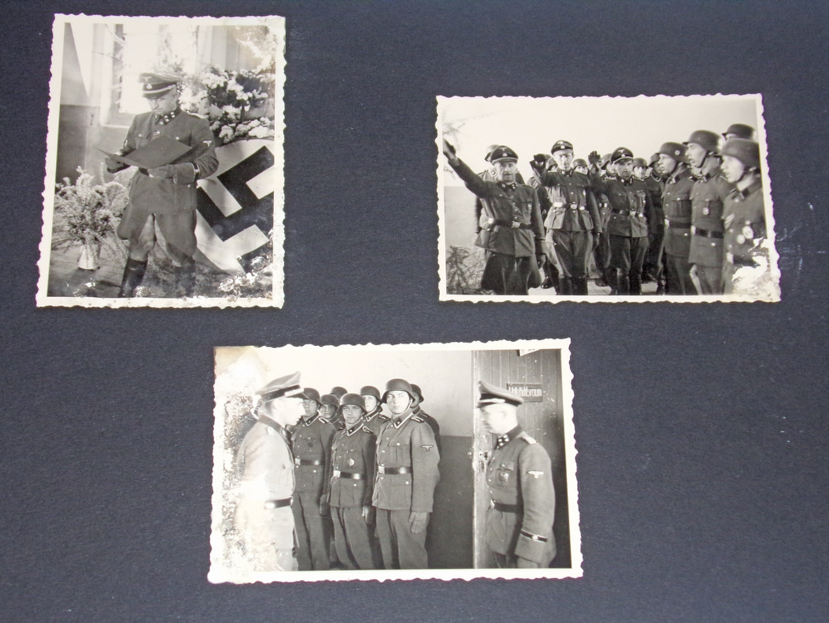 An SS Standard “Totenkopf” album features some inside pages with well-preserved snapshots of officers and military men.