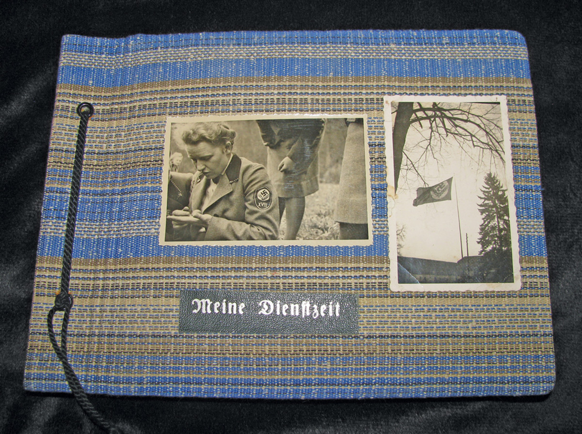 An album cover decorated with “My service Time”, photos of the woman and camp flag of the female RAD. The 1936 date inside supports the very early female Rad insignia worn in the photos.