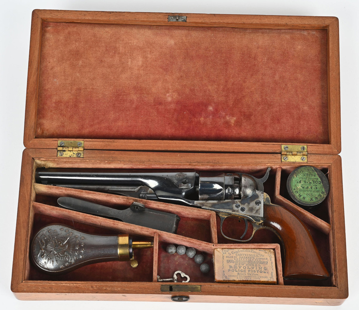 Colt Model 1862 Police Revolver, manufactured 1862, 6½in barrel, caliber .36 percussion. One of fewer than 29,000 produced. Original compartmented, velvet-lined case with pocket-size mechanical flask, iron 2-cavity mold, and rare ‘POLICE MODEL’ marked cartridge packet with correct 250-count Eley Bros. cap tin.