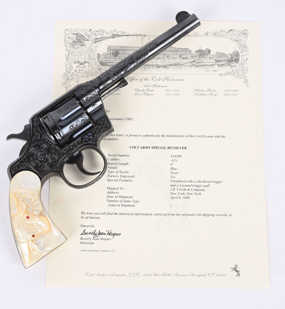Pearl-handled Colt .41-caliber Army Special Revolver sent in 1909 as a shipment of one to J.B. Crook & Co., New York, with engraving by Cuno Helfricht’s shop that includes a carved steer’s head with ruby eyes on right side of grip. Special features: checkered trigger, 4lb. trigger pull.