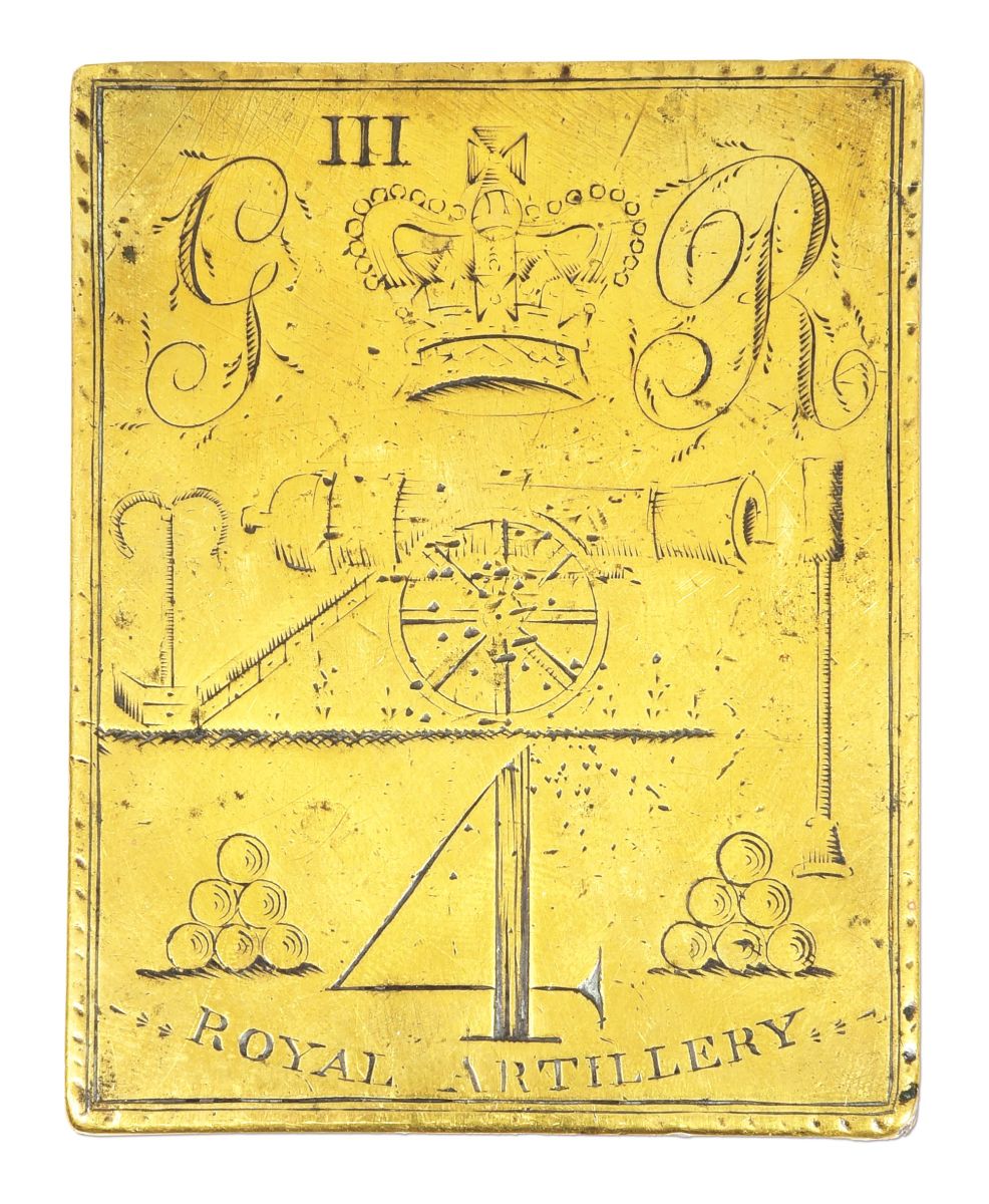 Revolutionary War belt plate of the 4th Battalion, Royal Artillery, with inscription “GR III,” and images of the Royal Crown of King George III, a cannon, and stacked cannonballs. Reference book example. Sold for $23,370