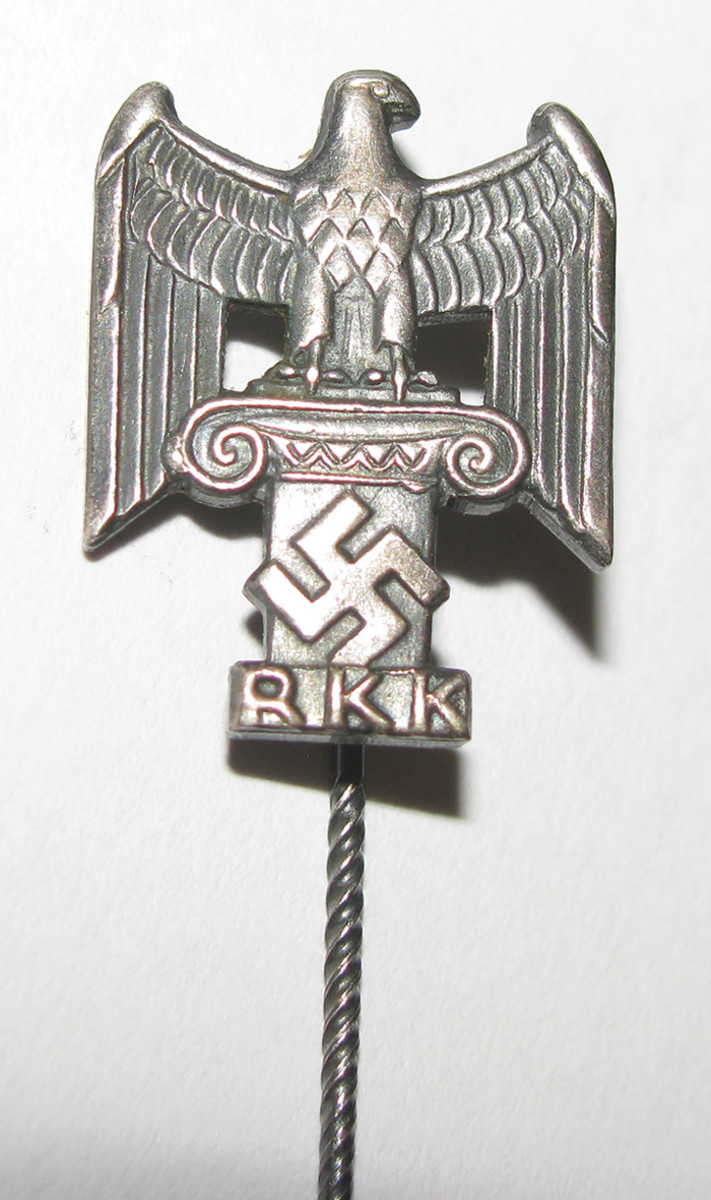 The RKK membership pin showed a bold classical design with an eagle and column.