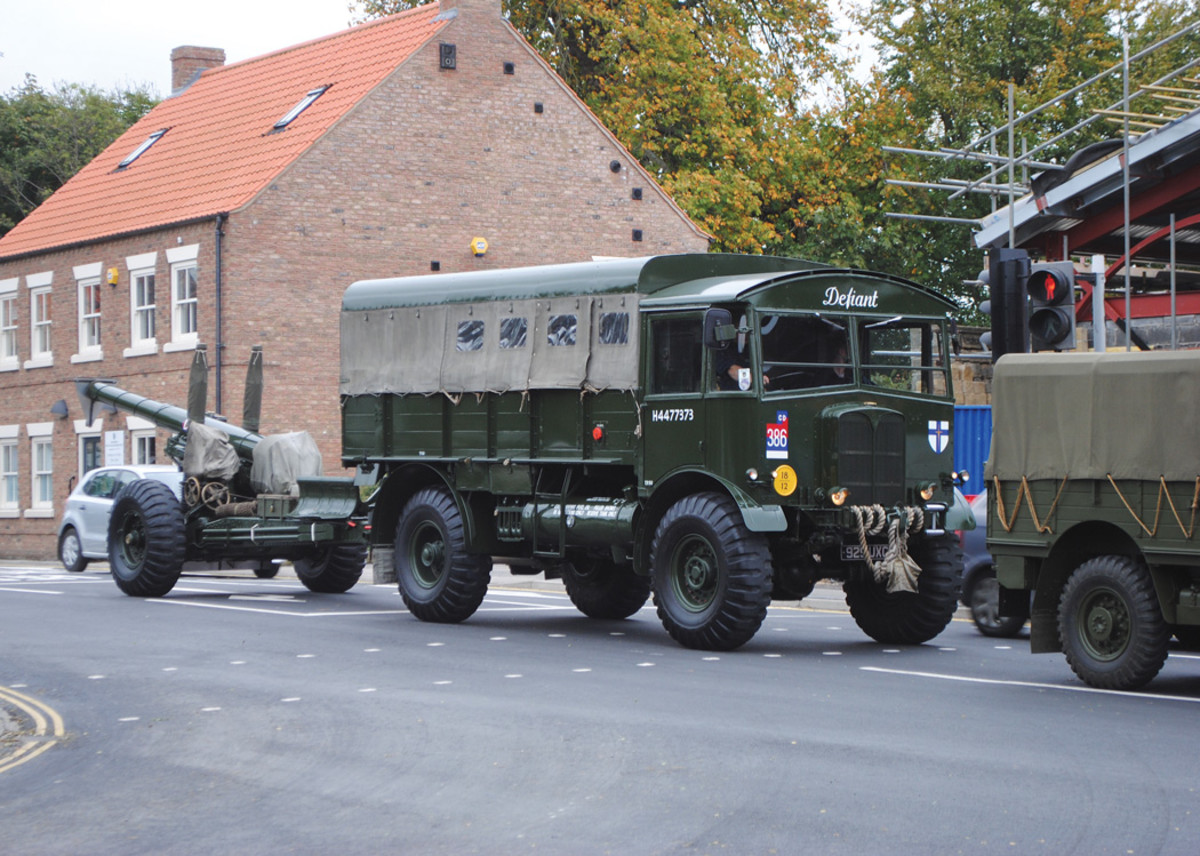 A sight not often seen in modern roads through towns, a Matador towing a 5.5-inch caliber medium field gun. The unit badge identifies it as serving with the British 2nd Army which landed at Normandy on D-Day.