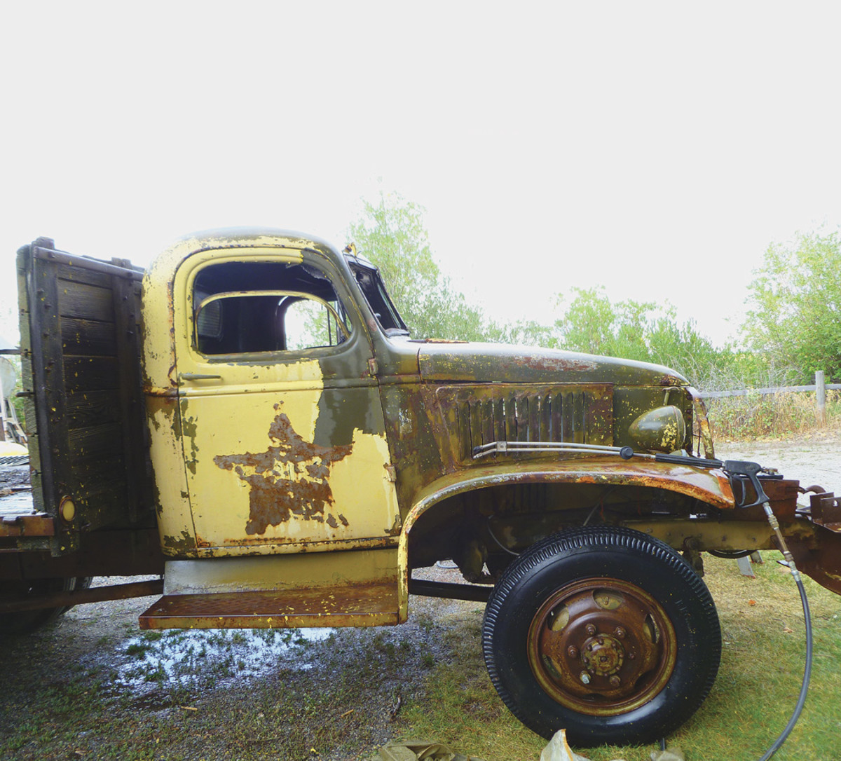 This 1942 closed cab GMC CCKW is an example of a truck that was painted yellow years ago. It was easily uncovered using a commercial steam cleaner to reveal the original olive drab green paint.