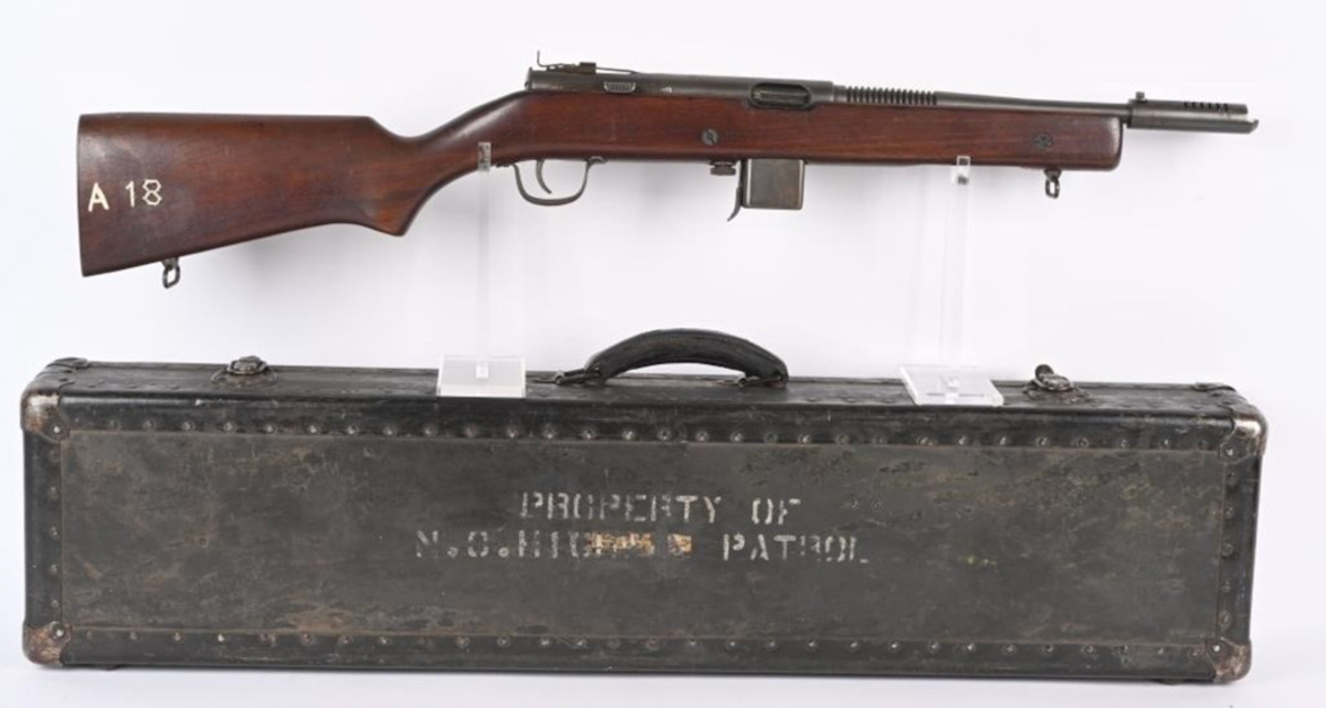 Circa-1940 Harrington & Richardson Model 50 submachine gun, caliber .45ACP, used by both US military and police personnel. Period case marked ‘Property N.C. Highway Patrol.’ Accompanied by six factory-marked 20-round magazines and one very rare 30-round magazine. An NFA-regulated firearm, it transferred to its new owner according to provisions set forth by BATFE. Sold above high estimate for $9,600