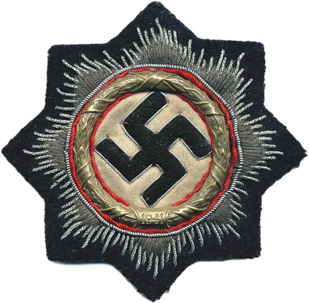 In addition to the two official metal versions, a cloth version for both grades was available with different cloth backgrounds, depending on the service branch of the bearer. The above German Cross in Silver with black cloth backing was for the Panzertruppe.