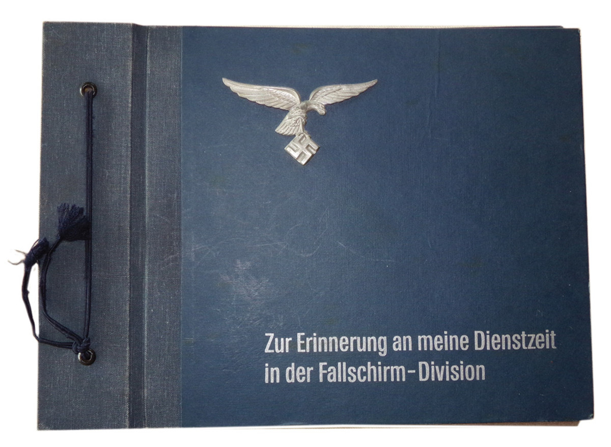 Another keepsake from this proud corps was a photo album with “Zur Erinnerung an meine Dienstzeit in der Fallschirm-Division” (In remembrance of my service time in the paratrooper division) printed on the cover under a flying Luftwaffe eagle and swastika.