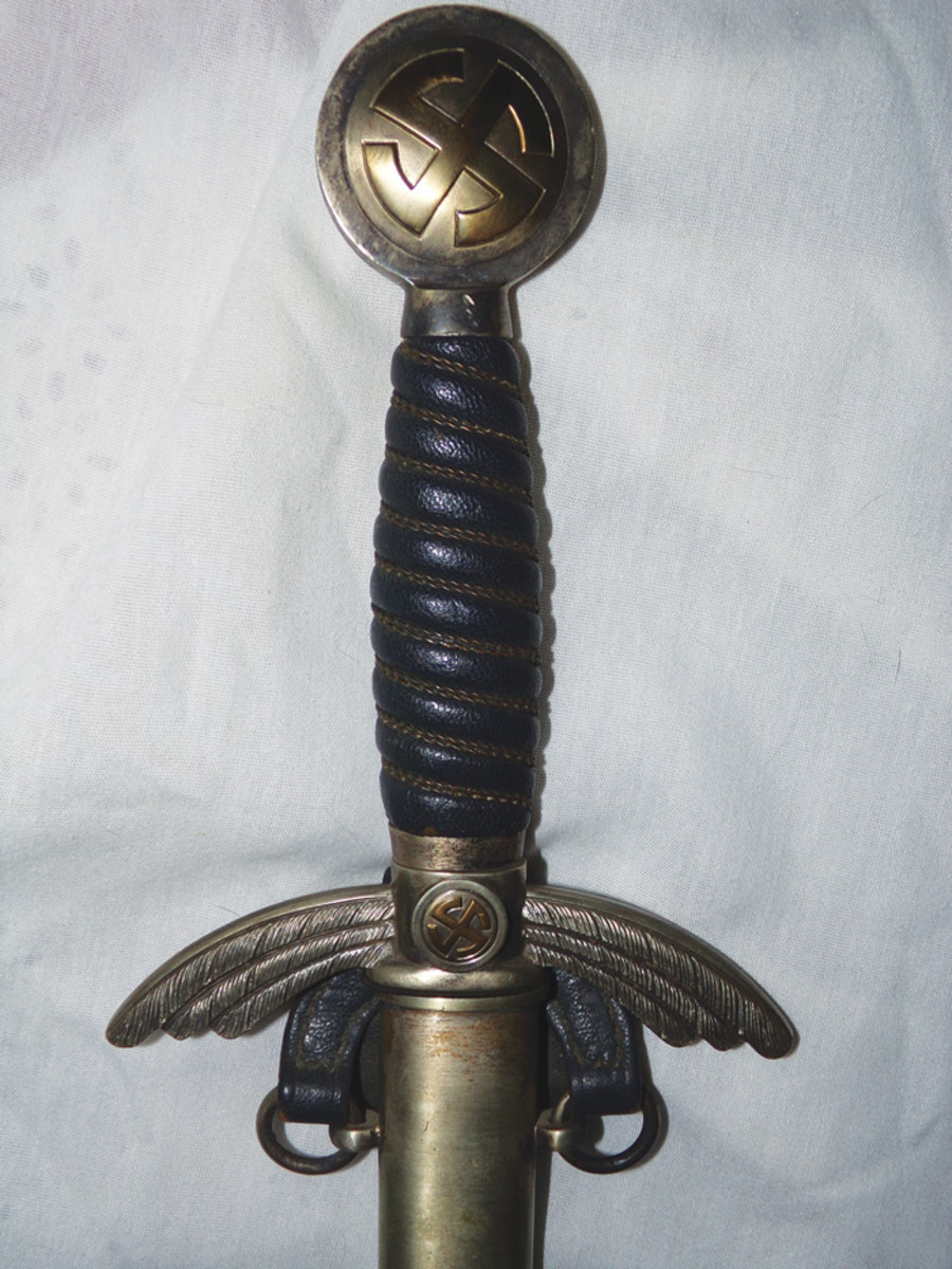 A Luftwaffe officer’s sword by Horster. Below the manufacturer’s mark is a Luftwaffe acceptance  eagle stamp.