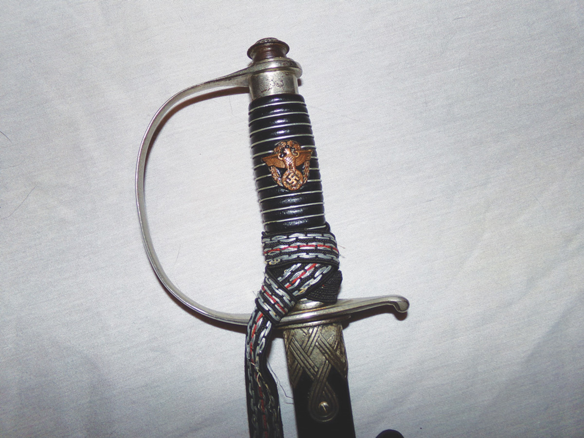 A police officer’s sword showing the eagle and wreath grip emblem. 