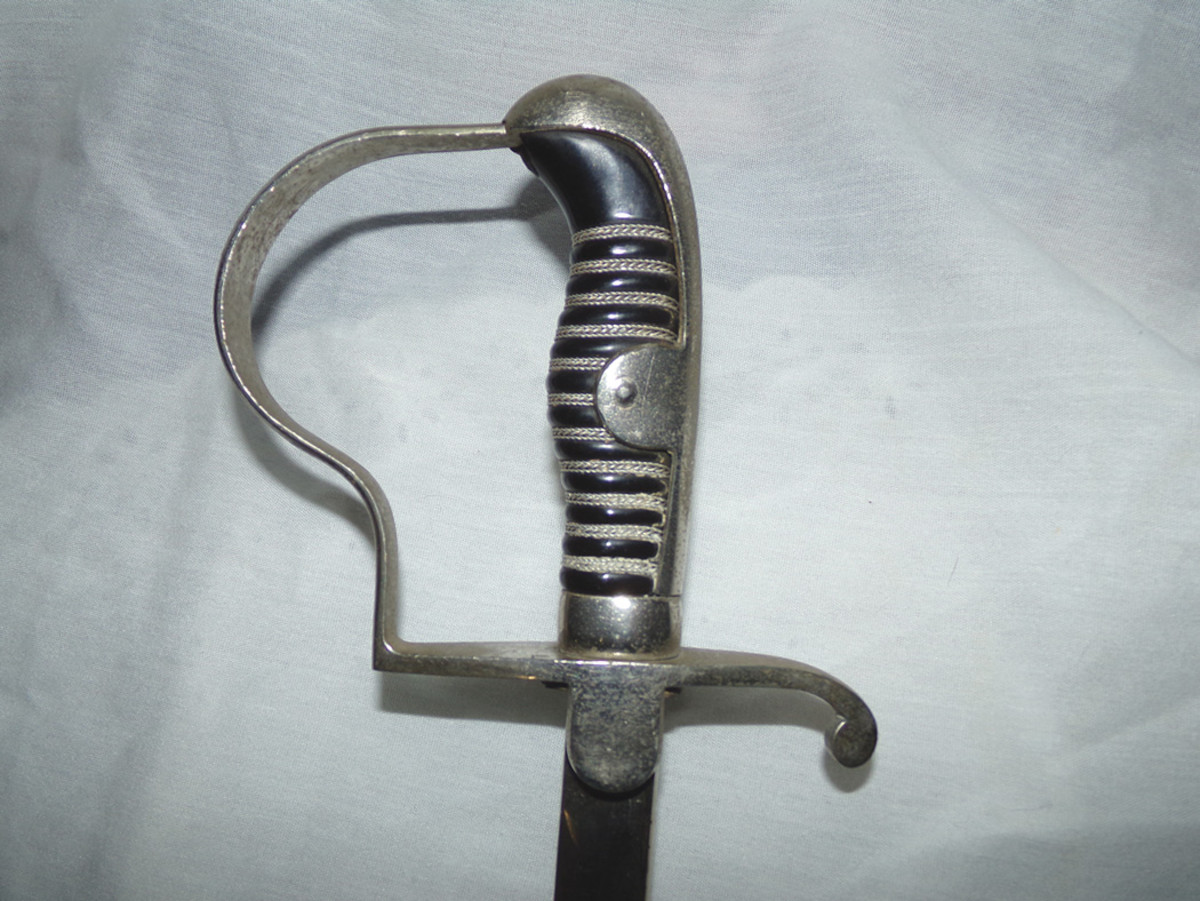 NCO sword with plain nickel-plated handle and black grip.