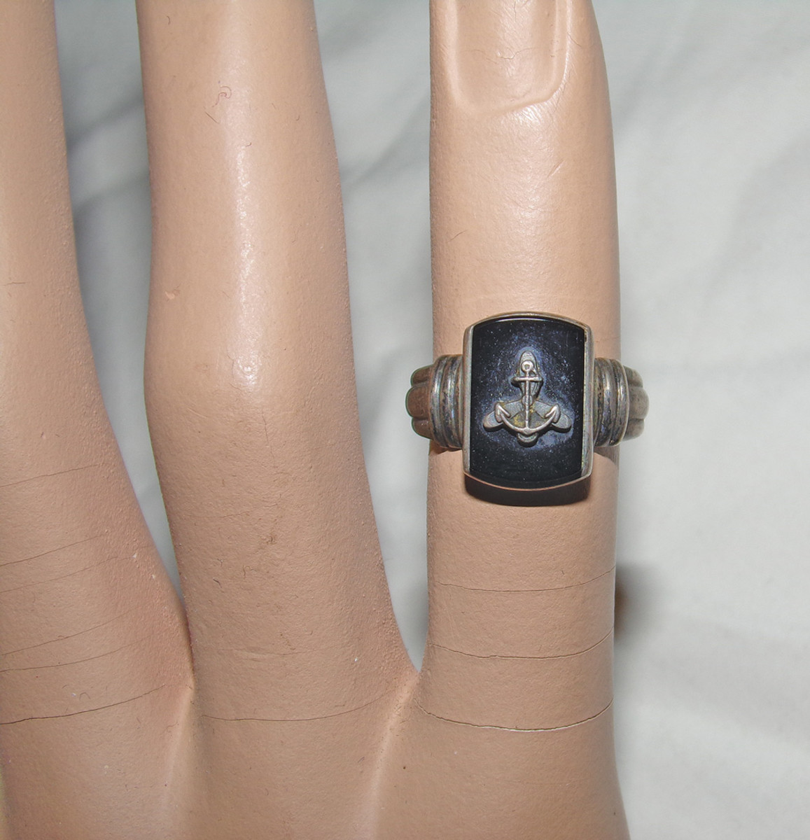 Beautiful gold and silver rings could be purchased by WAVEs to show their affiliation with the service. Both of these have the distinctive anchor over propeller insignia.