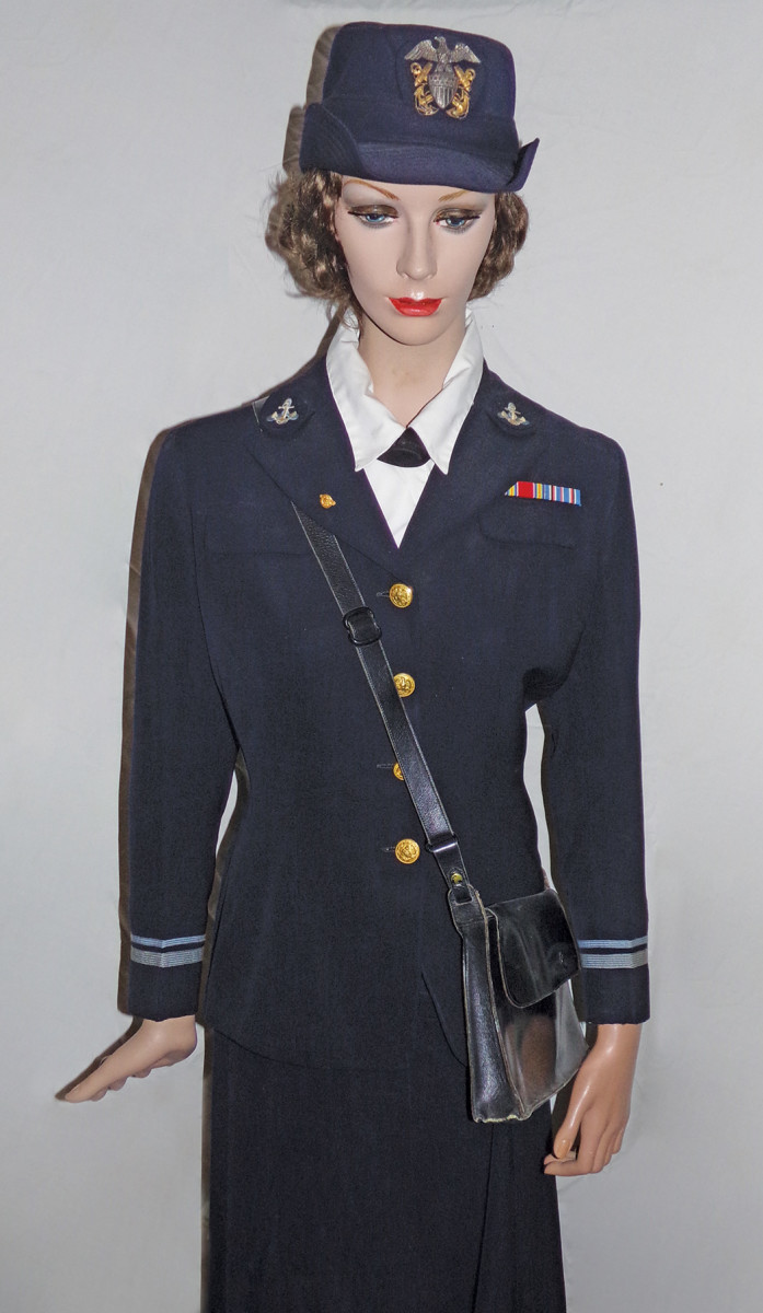 A stylish WAVE officer’s uniform with matching dark blue purse and officer’s dress cap.